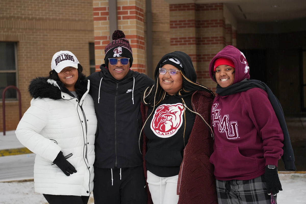 4 smiling AAMU students