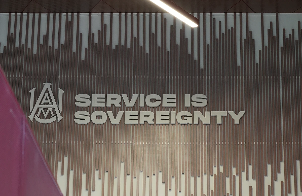 A sign on AAMU's campus that reads, "Service is Sovereignty"